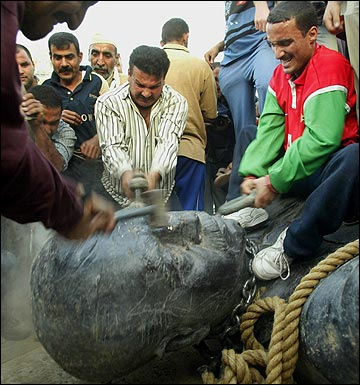 20030409_people_of_iraq_pull_down_and_smash_a_statue_of_former_dictator_saddam_hussein_as_baghdad_is_liberated