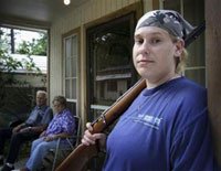 Shannon Morgan, a female soldier in an engineering unit featured in the film 'Lioness,' is seen here on the porch of her family's Mena, Arkansas home in this undated handout photo.
