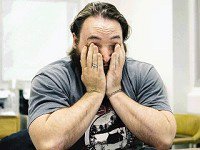 Veteran Peter Mohan cries while speaking about a friend of his who was killed in combat in Iraq.