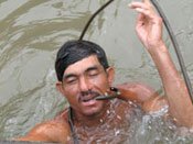 Divers in Vietnam are making a living off of war relics and corpses