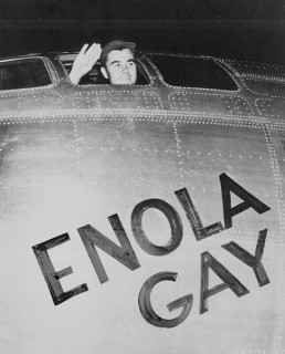 Col Paul Tibbets, pilot of the Enola Gay, waving from the cockpit.