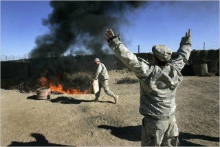 Army soldiers burning waste at an outpost in Iraq in 2007. The Pentagon has since restricted the use of such burn pits.