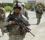 US soldiers patrol jointly with Canadian soldiers and the Afghan National Army in Kandahar