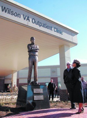 Buddy Temple and Barbara Wilson, right, admire the statue of Charlie Wilson unveiled in front of the Charles Wilson VA Outpatient Clinic Wednesday afternoon, JOEL ANDREWS The Lufkin Daily News