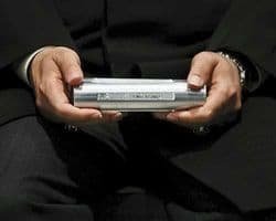 Iranian official holds container of UF6 Tuscon Citizen