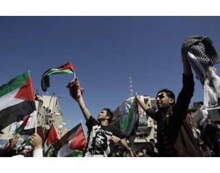 Palestinians take part in a rally in Ramallah