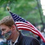 OWS Boy with20 dollar taped to his mouth