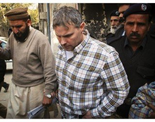 File photo of U.S. consulate employee Raymond Davis being escorted in Lahore