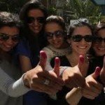 Young girls voting in their first elections