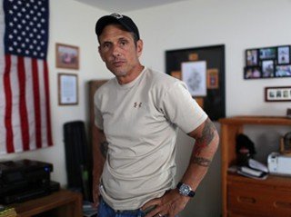 Ted Richardson/For The Washington Post - Matthew Goldberg, a retired Army special forces soldier who fought the VA for disability compensation for post-traumatic stress disorder and other injuries, at his home in Hampstead, N.C., on Sept. 7.