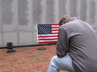 Former Marine Ed Ayers of Scranton, Penn., hangs his head and weeps at the Beirut Bombing Memorial in Jacksonville, NC, on Wednesday (photo credit: AP/Allen G. Breed) 