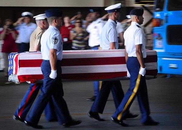 Petty Officer 1st Class Barry Hirayama / U.S. Navy A joint service honor guard escorts a transfer case during an "arrival ceremony" at Joint Base Pearl Harbor-Hickam in Honolulu on April 27, 2012. The Defense Department has acknowledged that human remains were not in fact arriving on that day. The ceremonies are held by the Pentagon's Joint POW/MIA Accounting Command.