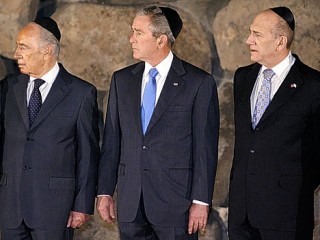 Bush (43) - submitting to the dress up doll treatment - a public act of submission to the Israel Lobby