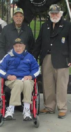 World War II Veteran Aldo Dipre` is flanked by Vietnam War Veterans Gil Flores and John Rowan