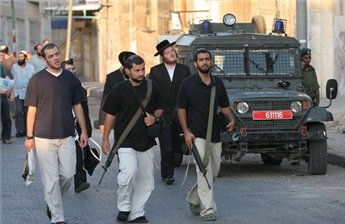 European Settlers prowl the streets backed the IDF as they engage in intimidation and confiscation 