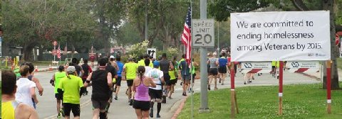 There are 20,000 homeless Veterans in Los Angeles, yet the VA claims they will end it next year as seen in this billboard while 30,000 LA Marathoners charge by on the very property deeded exclusively as a National Veterans Home.