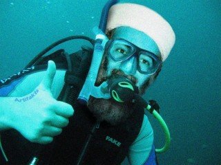 US Special Forces frogman Tim Osman celebrates successful stashing of MH370 in underwater sea cave beneath Diego Garcia