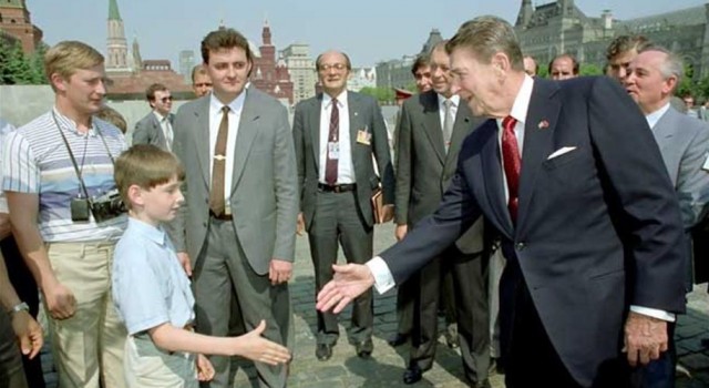 The boy is Putin's son. Gorbechov if over Reagan's shoulder. Can you find Vladimir?