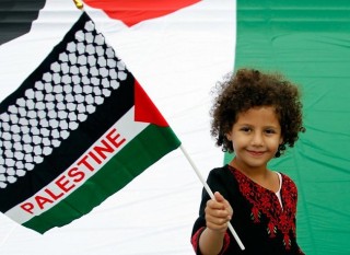 Palestinian girl waves flag in Belgium