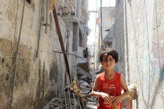 Gaza Residents Inspect Remains After Israeli Air Strikes