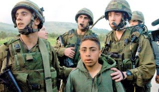 IDF soldiers apprehending a Palestinian boy