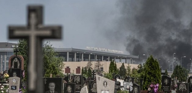 Smoke rises through a cemetery over the Donetsk airport during fighting between Ukrainian forces and pro-Russian separatists earlier this year.