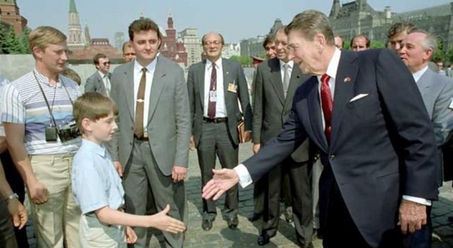 Putin (L) with his son, on Reagan's security detail, gets a family photo