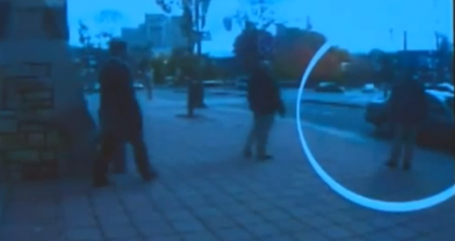These four individual's converge concurrently just before the alleged shooter's care approaches Parliament Hill. When the car pulls up they all move toward the Corolla as if to greet it. What is going on here?