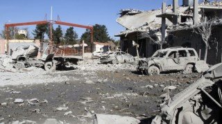 Damaged cars are seen on November 29, 2014 near Mursitpinar crossing gate between Syria and Turkey after car bombs attacks by ISIL.