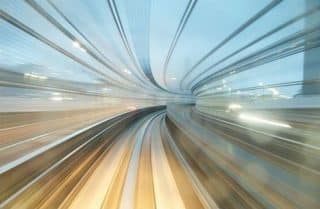High speed rail zooms through a city