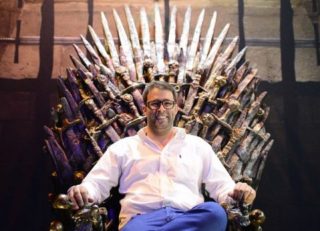 Knesset member Oren Hazan sits in a model of the Iron Throne from TV's "Game of Thrones"
