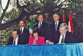 Back row, left to right: Mexican President Carlos Salinas de Gortari, U.S. President George H. W. Bush, and Canadian Prime Minister Brian Mulroney, at the initialing of the draft North American Free Trade Agreement in October 1992