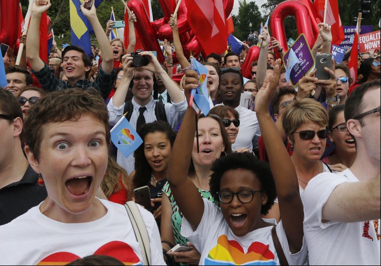 Gay rights supporters celebrate after the US Supreme Court ruled that the US Constitution provides same-sex couples the right to marry.