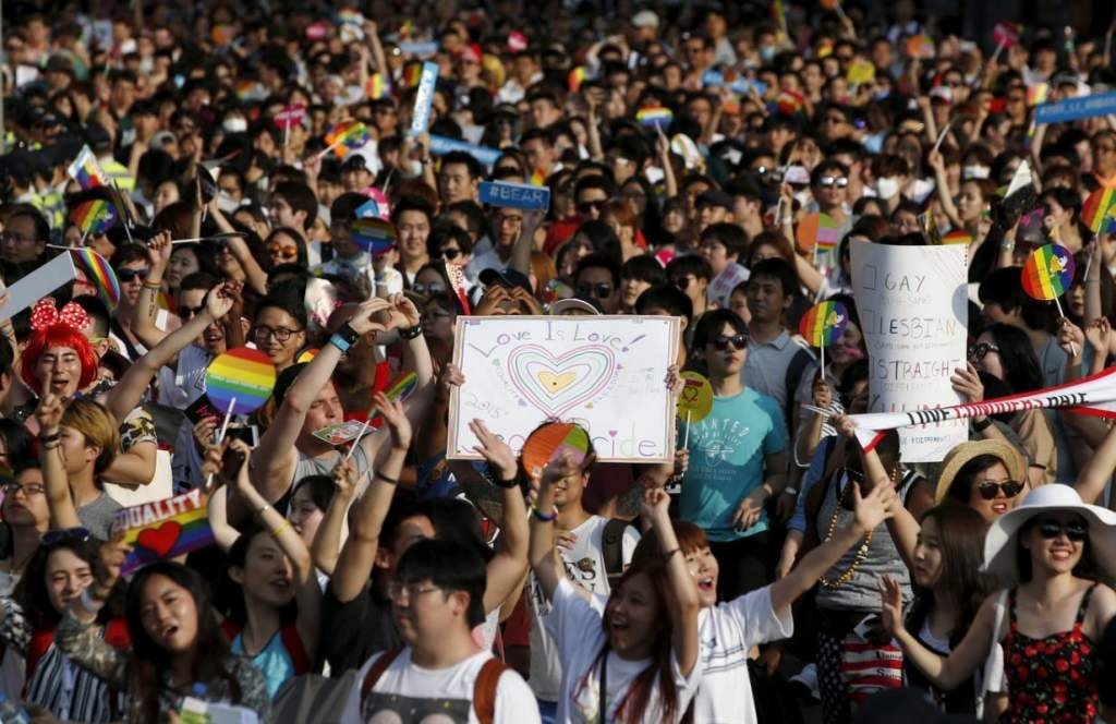 Participants march on a street during Korea Queer Festival 2015 in central Seoul, South Korea, June 28, 2015. Several hundreds gays, lesbians and transgender people held the gay pride march to push for their rights. The rally in the center of Seoul came against the backdrop of the U.S. Supreme Court's landmark decision on Friday to grant a constitutional right to same-sex marriage. Over 20,000 people including lesbians, gays, bisexuals and transgenders joined the annual queer festival, the organizer said. REUTERS/Kim Hong-Ji
