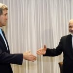 U.S. Secretary of State John Kerry shakes hands with Iranian Foreign Minister Mohammad Javad Zarif before a meeting in Geneva