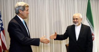 U.S. Secretary of State John Kerry shakes hands with Iranian Foreign Minister Mohammad Javad Zarif before a meeting in Geneva last year.