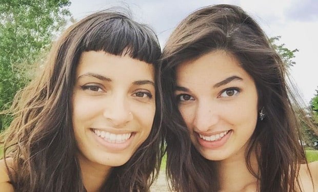 Alysha Brilla (left) poses with one of her sisters