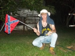 Dylann Roof in one of several photographs where he is shown posing with the Confederate Battle Flag