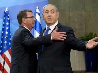 Ashton Carter waits for his hug from Binyamin Netanyahu