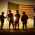 WWII Soldiers Standing In A Flag Draped Sunset – SIlhouette