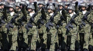 Members of Japan's Self-Defence Forces' airborne troops march during the annual SDF troop review ceremony at Asaka Base in Asaka, near Tokyo October 27, 2013.