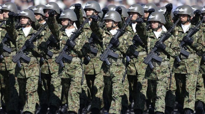 Japan Self-Defence Forces' troops march during the annual SDF troop review ceremony at Asaka Base in Asaka, Japan