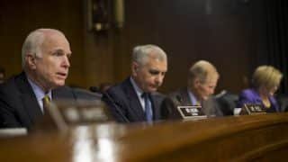 Senate Armed Services Committee Chairman Sen. John McCain, left, questions Gen. Austin on Wednesday