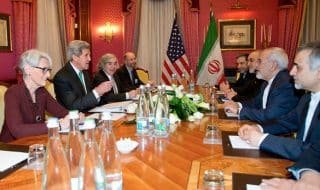 U.S. negotiators, left, face Iranian negotiators during the March 17 Iran Nuclear Discussions morning meeting with Secretary of State John Kerry in Lausanne with Iranian Foreign Minister Zarif. Under Secretary Wendy Sherman and Energy Secretary Ernest Moniz participated in the meetings. Copyright Creative Commons/Credit: U.S. Mission / Eric Bridiers