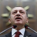Turkey’s Prime Minister Tayyip Erdogan addresses members of parliament from his ruling AK Party during a meeting at the Turkish parliament in Ankara